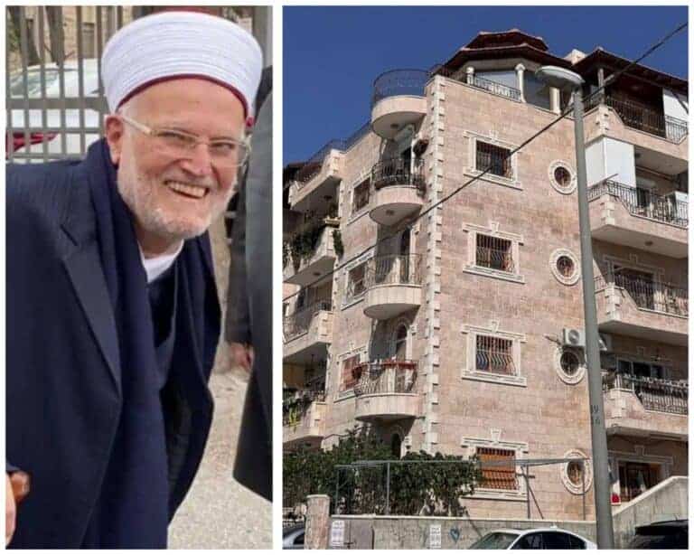 Sheikh Ikrima Sabri alongside the building at the center of the demolition controversy in East Jerusalem